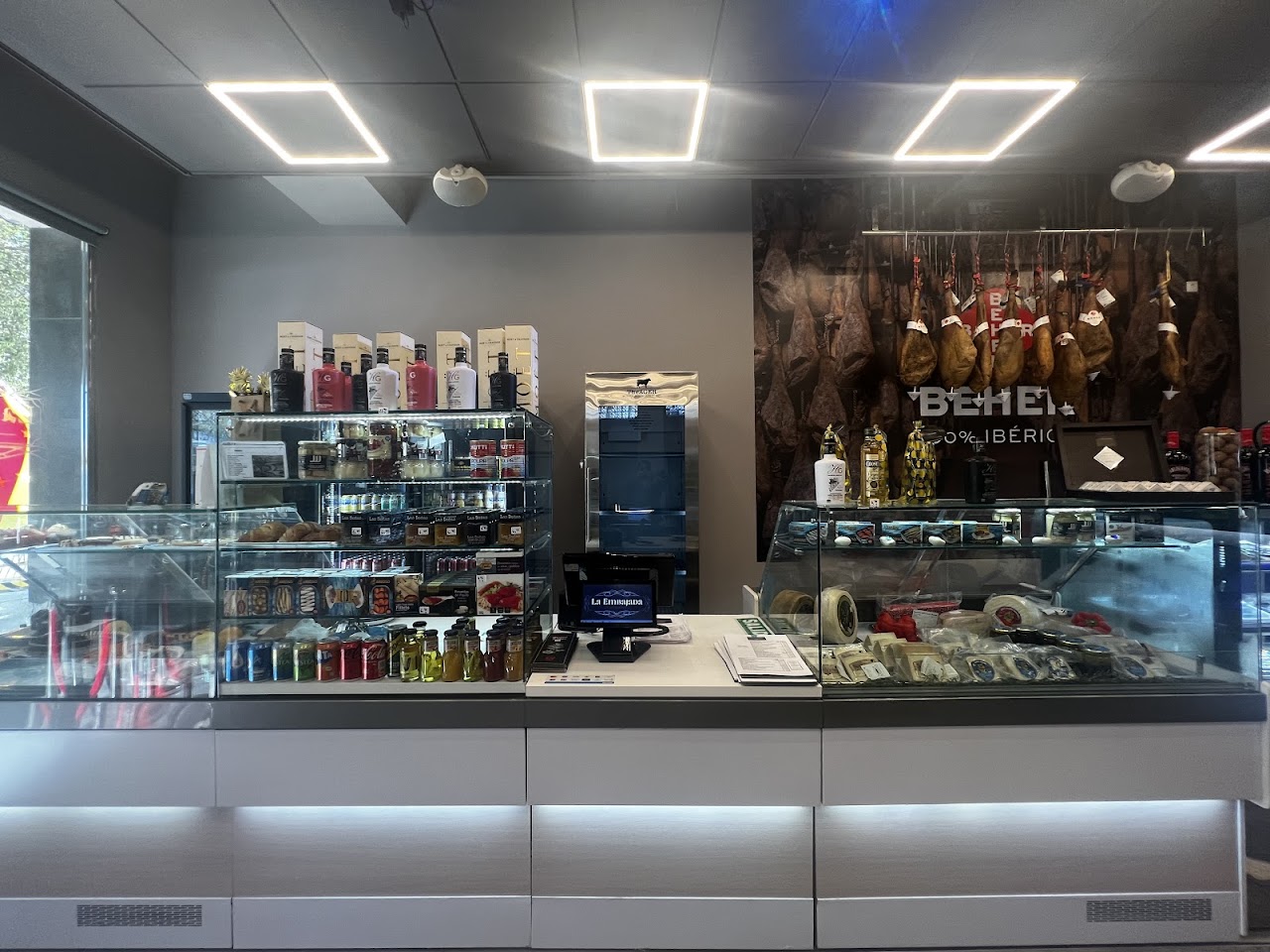 Gourmet counter with acorn-fed Iberian ham and select produce